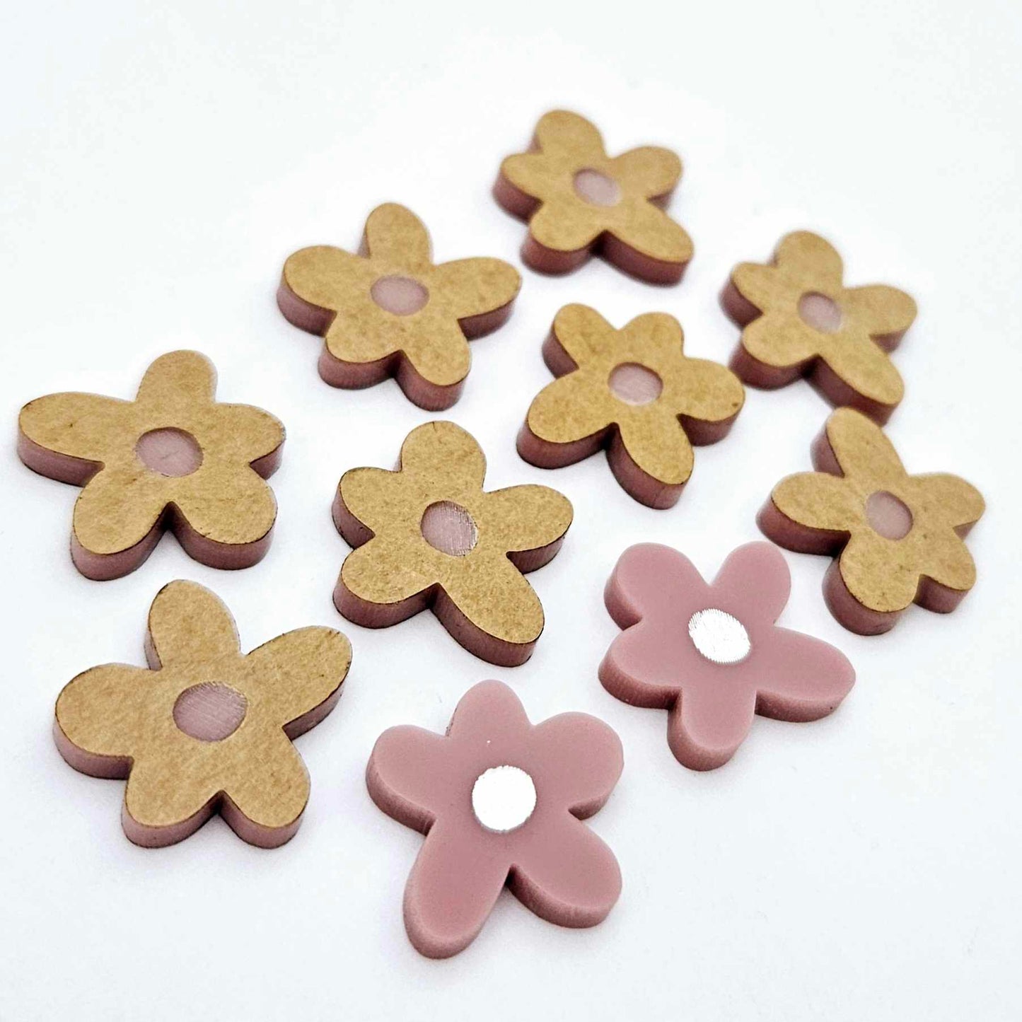 16mm dusty rose organic flower stud blanks with engraved centre, one pair paint filled white and several unfilled pieces shown with protective film on