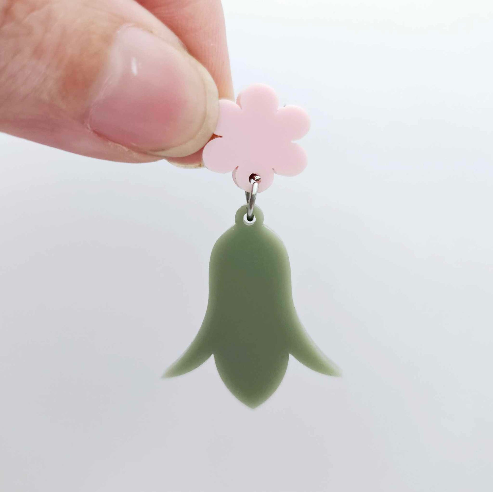 28mm olive green acrylic nodding flower dangle hanging from a 14mm flower topper, shown as a completed earring design