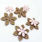 Iced Coffee Brown and strawberry milkshake pink acrylic two layer flower dangle blanks shown laying flat, with some flowers stacked to show layered effect and others positioned side by side