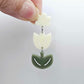 Cream and Olive Green acrylic tulip shape earring blanks shown with a cream flower toppers
