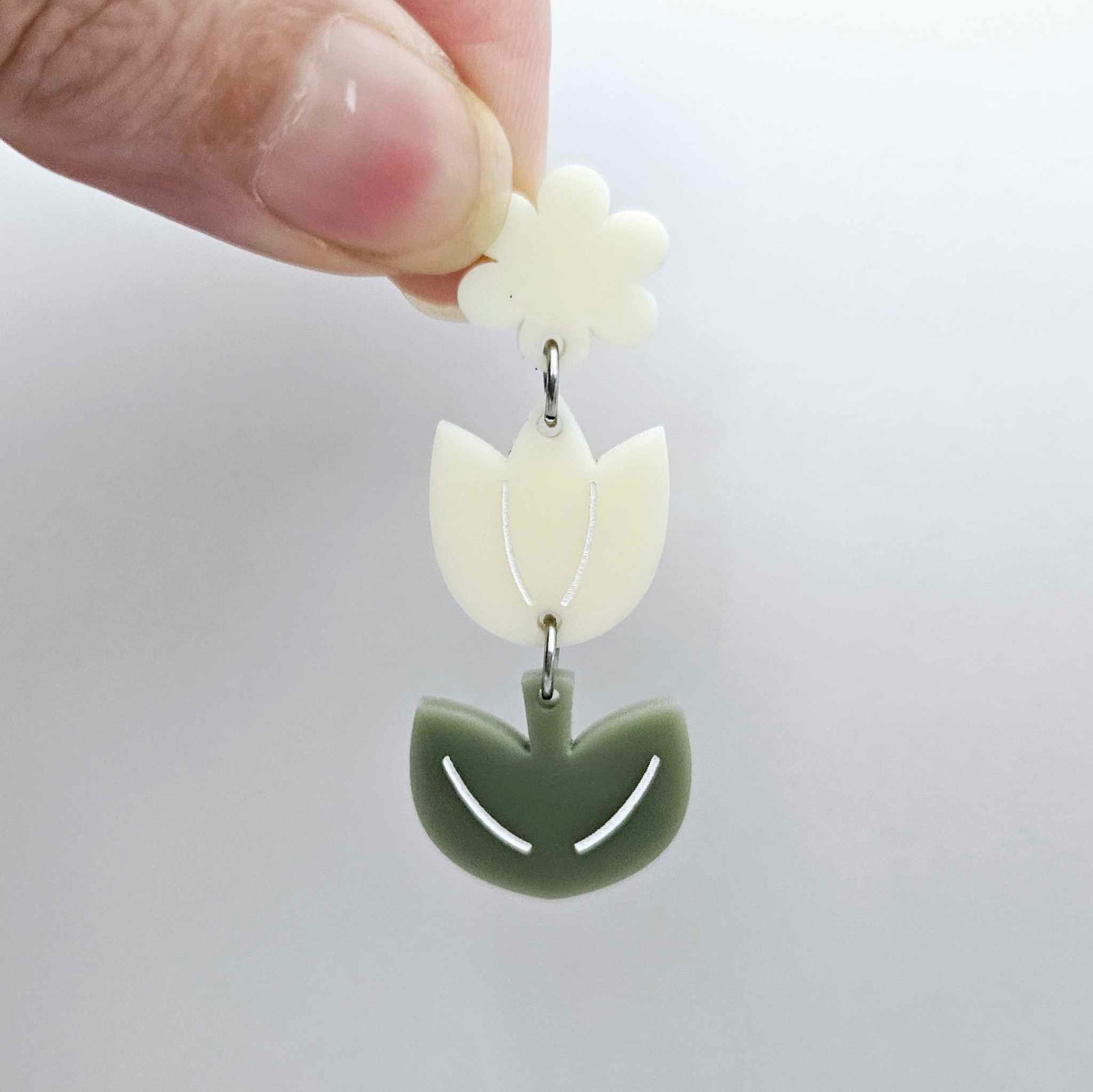 Cream and Olive Green acrylic tulip shape earring blanks shown with a cream flower toppers