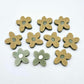 16mm Olive green organic flower stud blanks with engraved centre, one pair paint filled white and several unfilled pieces shown with protective film on