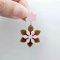 Layered iced coffee and strawberry milkshake flower dangle assembled and hanging from a strawberry milkshake flower topper, 3D two tone floral design