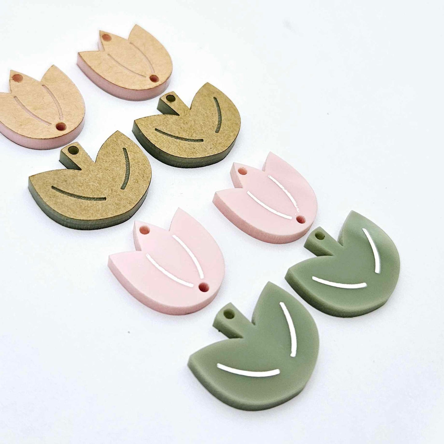 Dusty pale pink and olive green acrylic tulip dangle blanks, one pair paint filled white and one pair with protective paper on, shown as a two-piece floral design