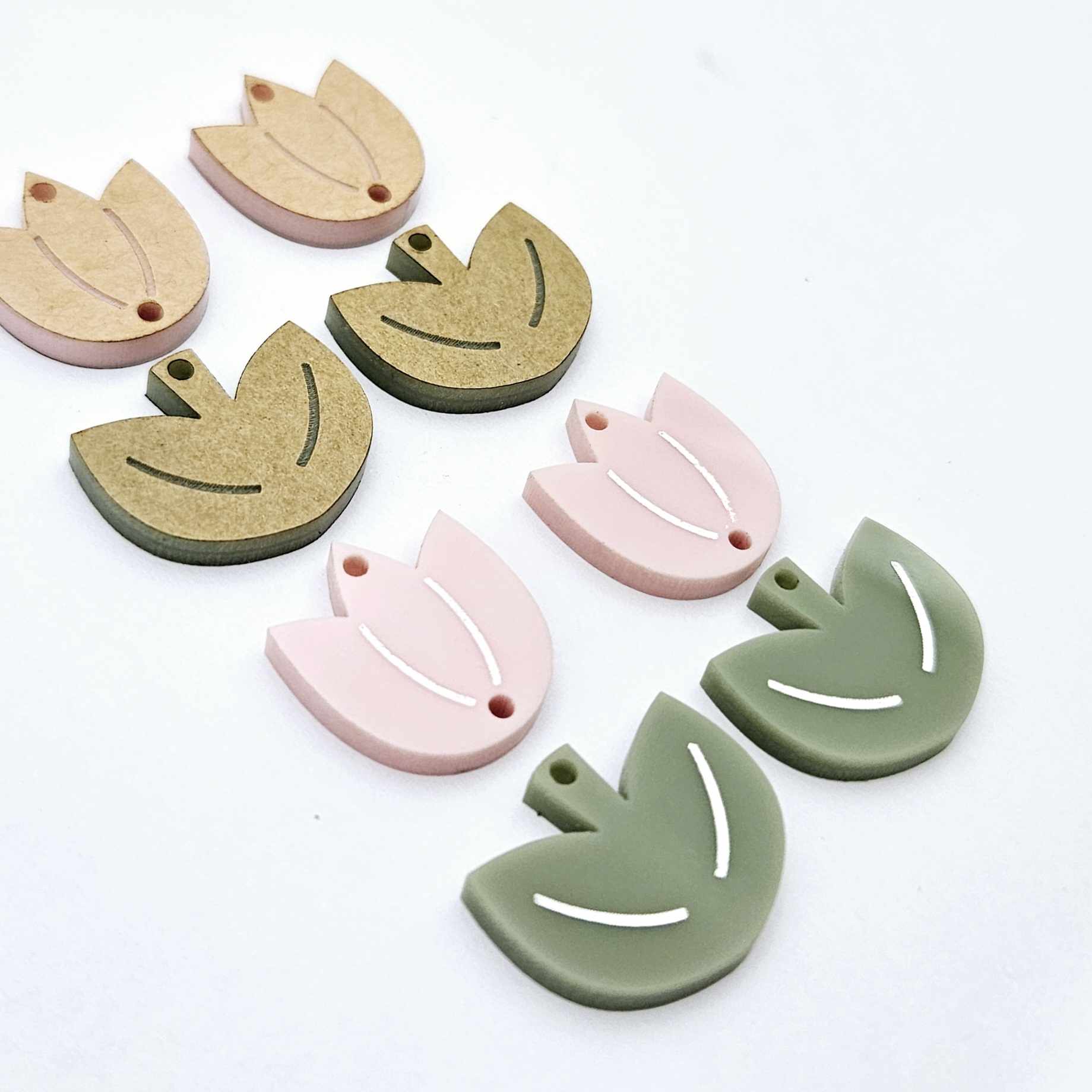 Dusty pale pink and olive green acrylic tulip dangle blanks, one pair paint filled white and one pair with protective paper on, shown as a two-piece floral design