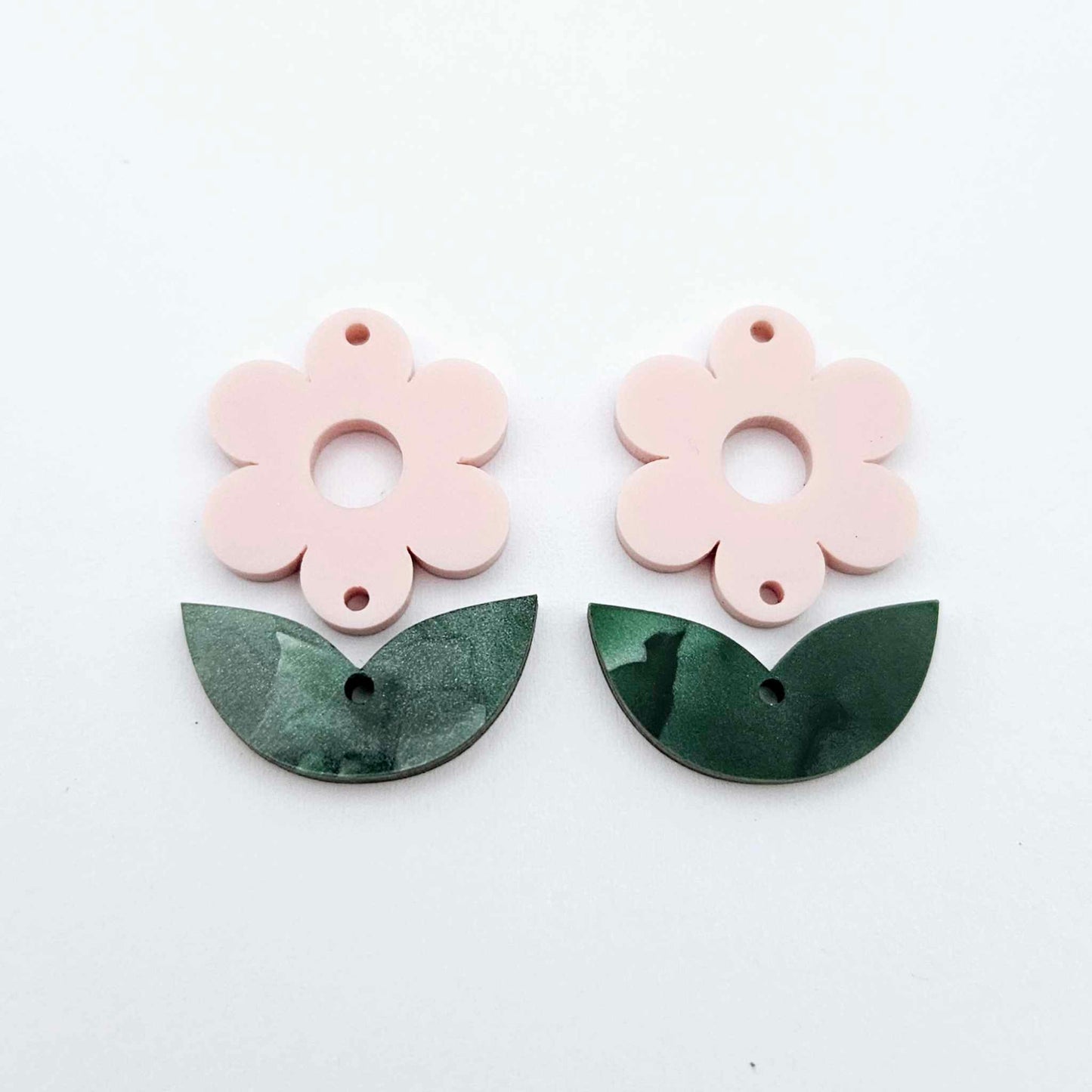 Two-piece Strawberry Milkshake pink flower and green mineral acrylic leafy dangle blanks shown unassembled and laying flat to display the full 31mm floral design