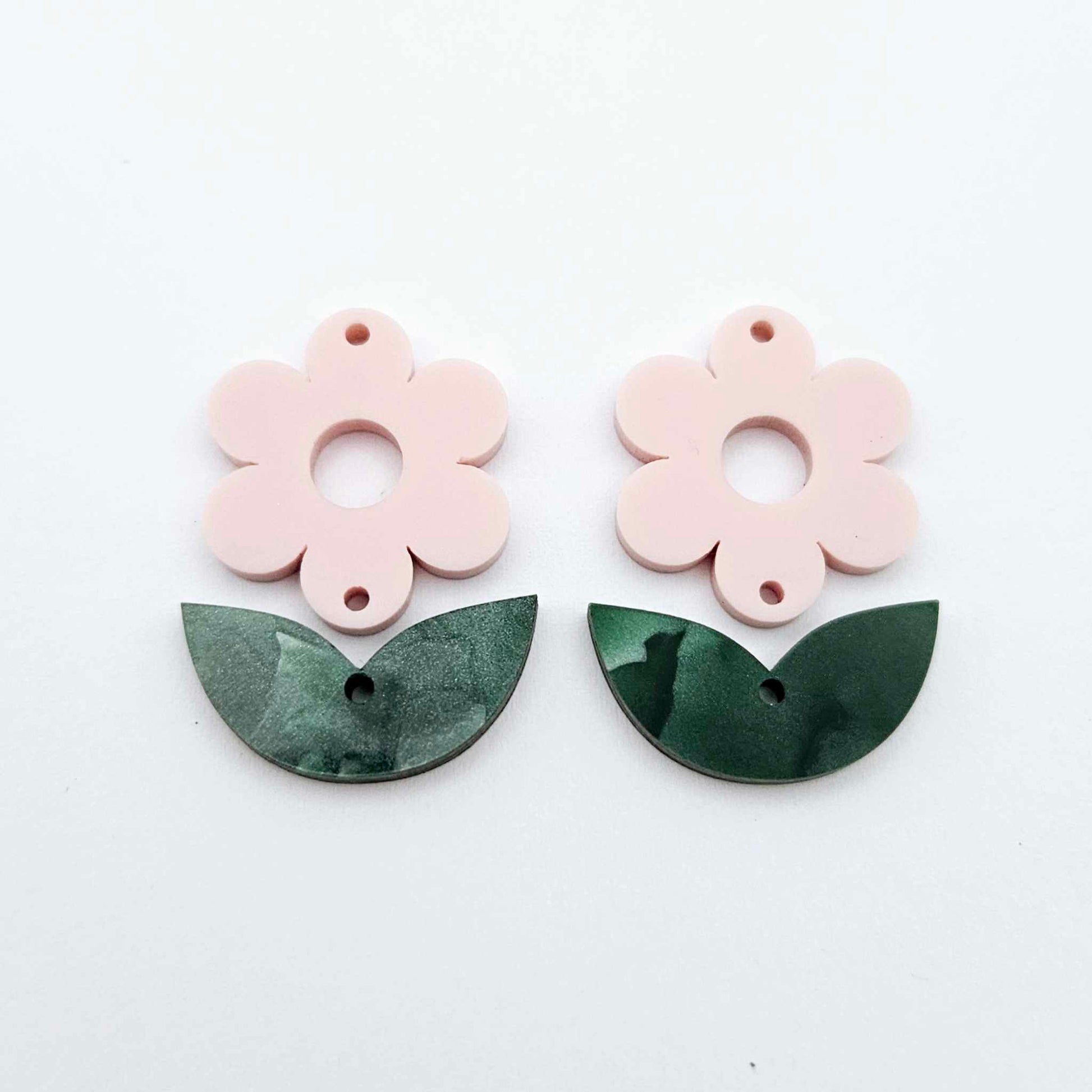 Two-piece Strawberry Milkshake pink flower and green mineral acrylic leafy dangle blanks shown unassembled and laying flat to display the full 31mm floral design