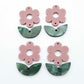 Two-piece dusty rose flower and green mineral acrylic leafy dangle blanks shown unassembled and laying flat to display the full 31mm floral design