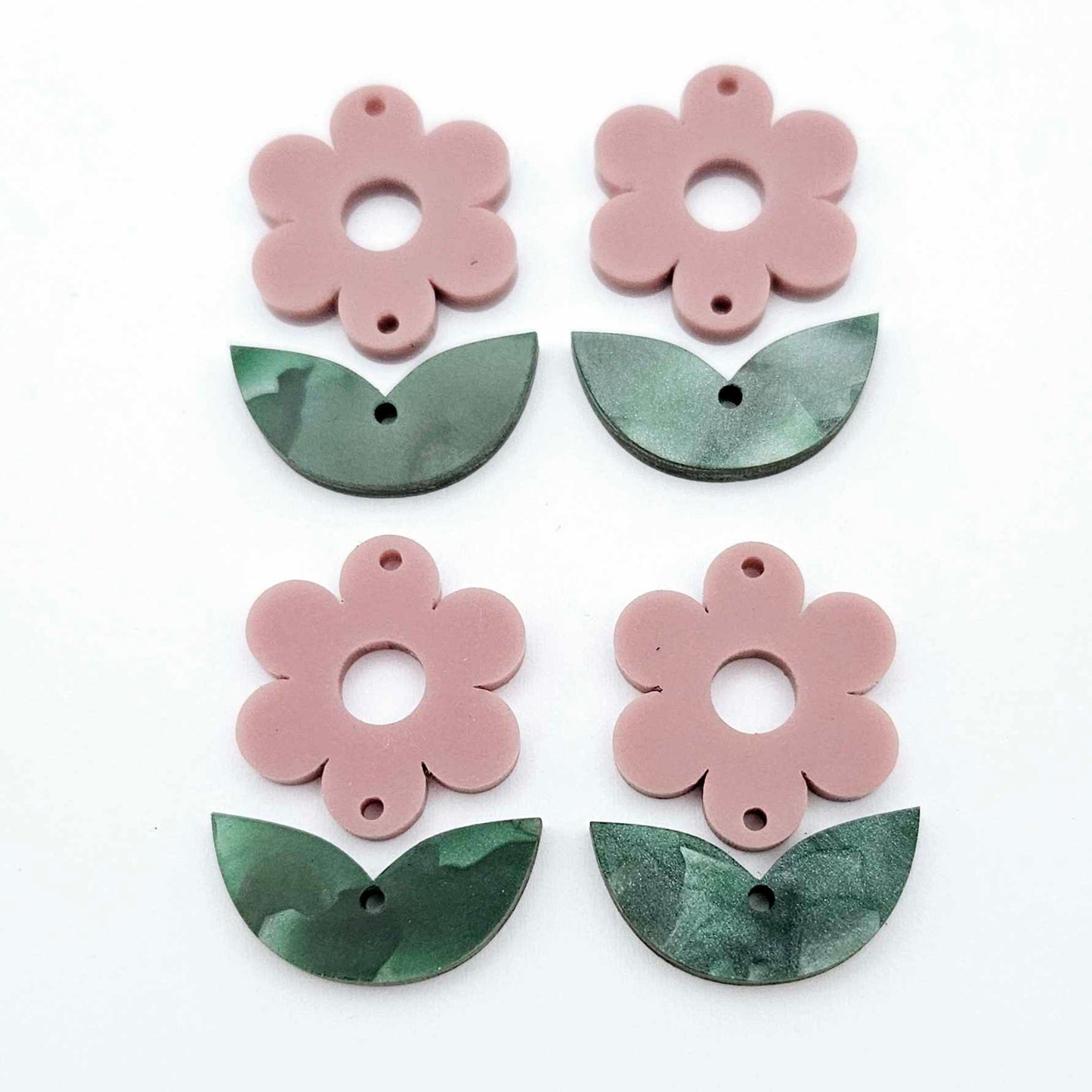 Two-piece dusty rose flower and green mineral acrylic leafy dangle blanks shown unassembled and laying flat to display the full 31mm floral design