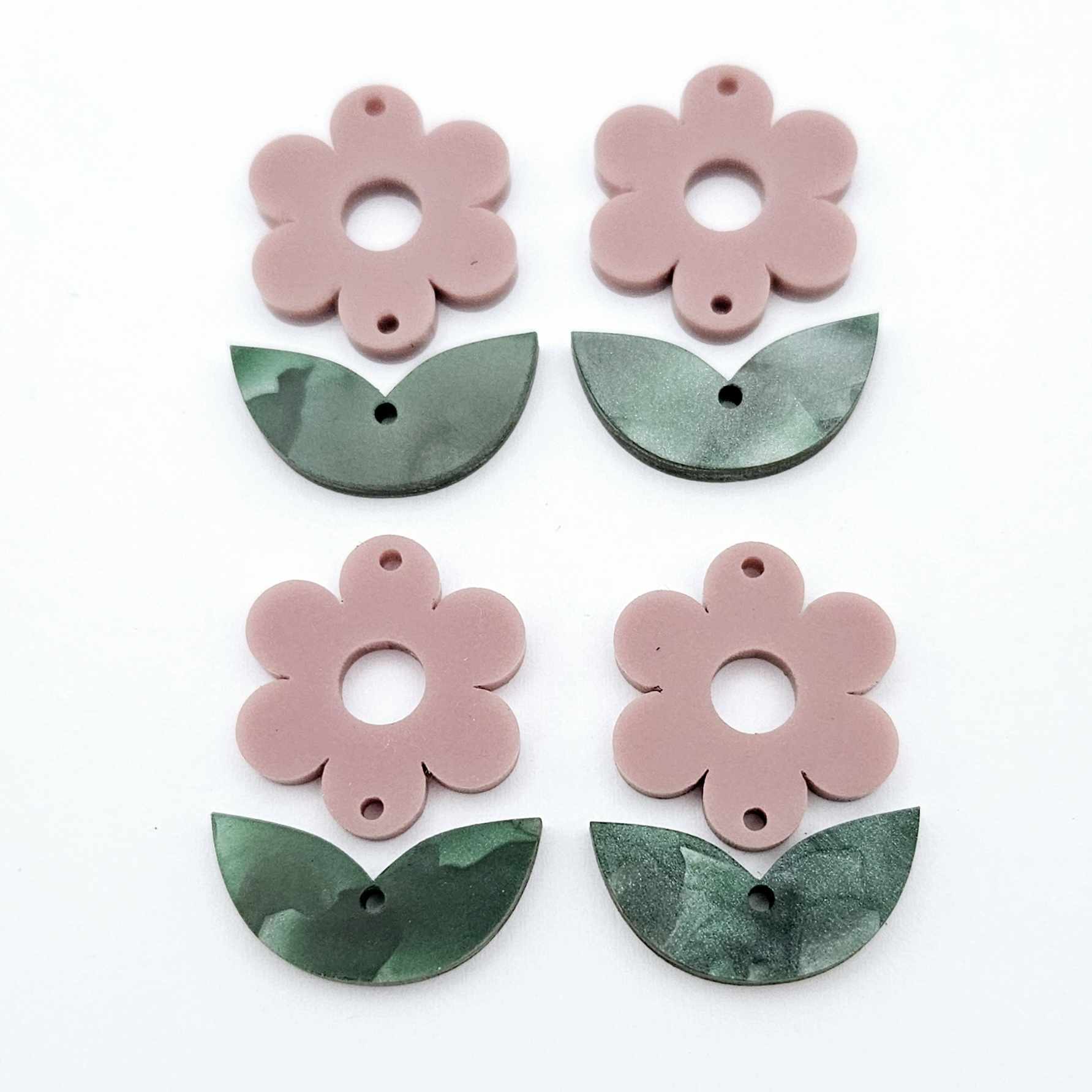 Two-piece dusty rose flower and green mineral acrylic leafy dangle blanks shown unassembled and laying flat to display the full 31mm floral design