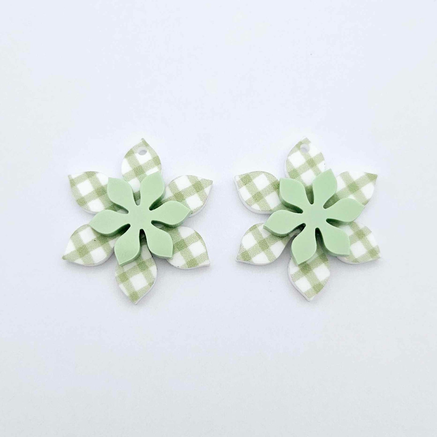 Green gingham UV print and pastel green acrylic two layer flower dangle blanks shown laying flat, with flowers stacked to show layered effect
