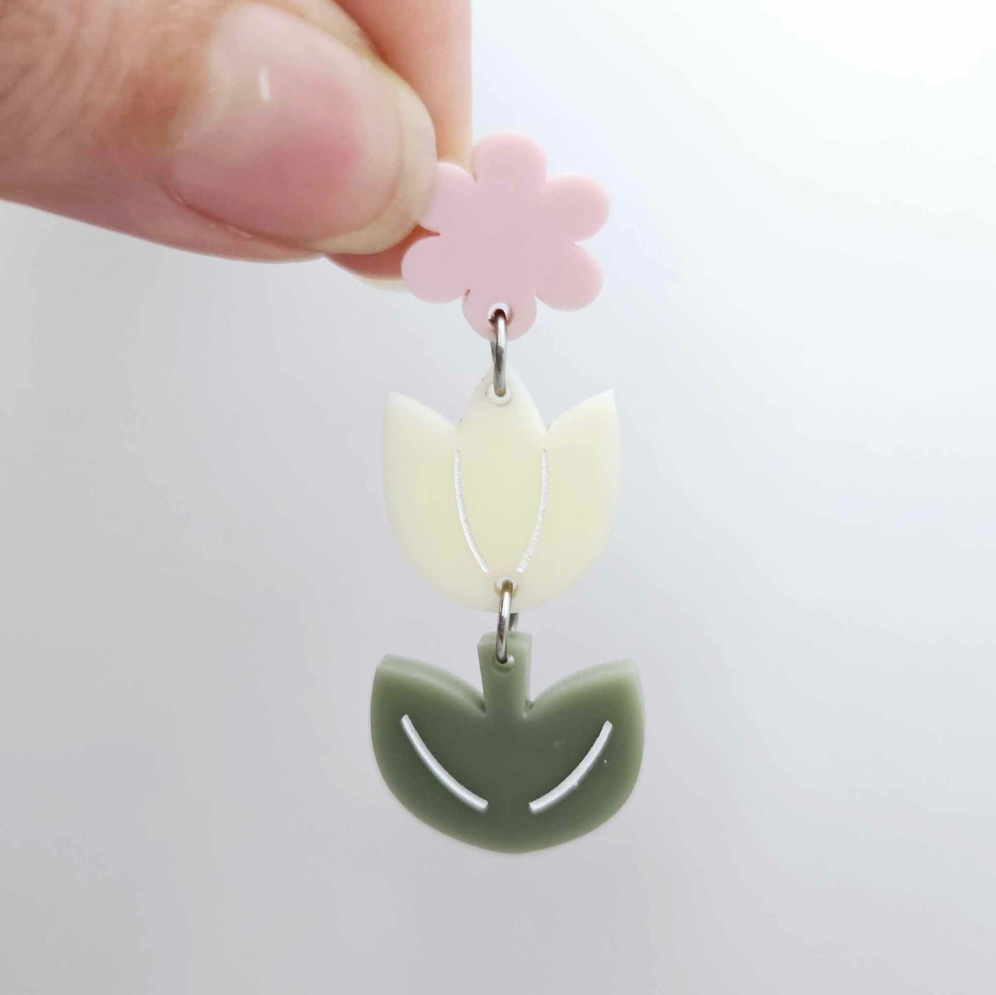 Cream and Olive Green acrylic tulip shape earring blanks shown with one of our strawberry milkshake pink flower toppers