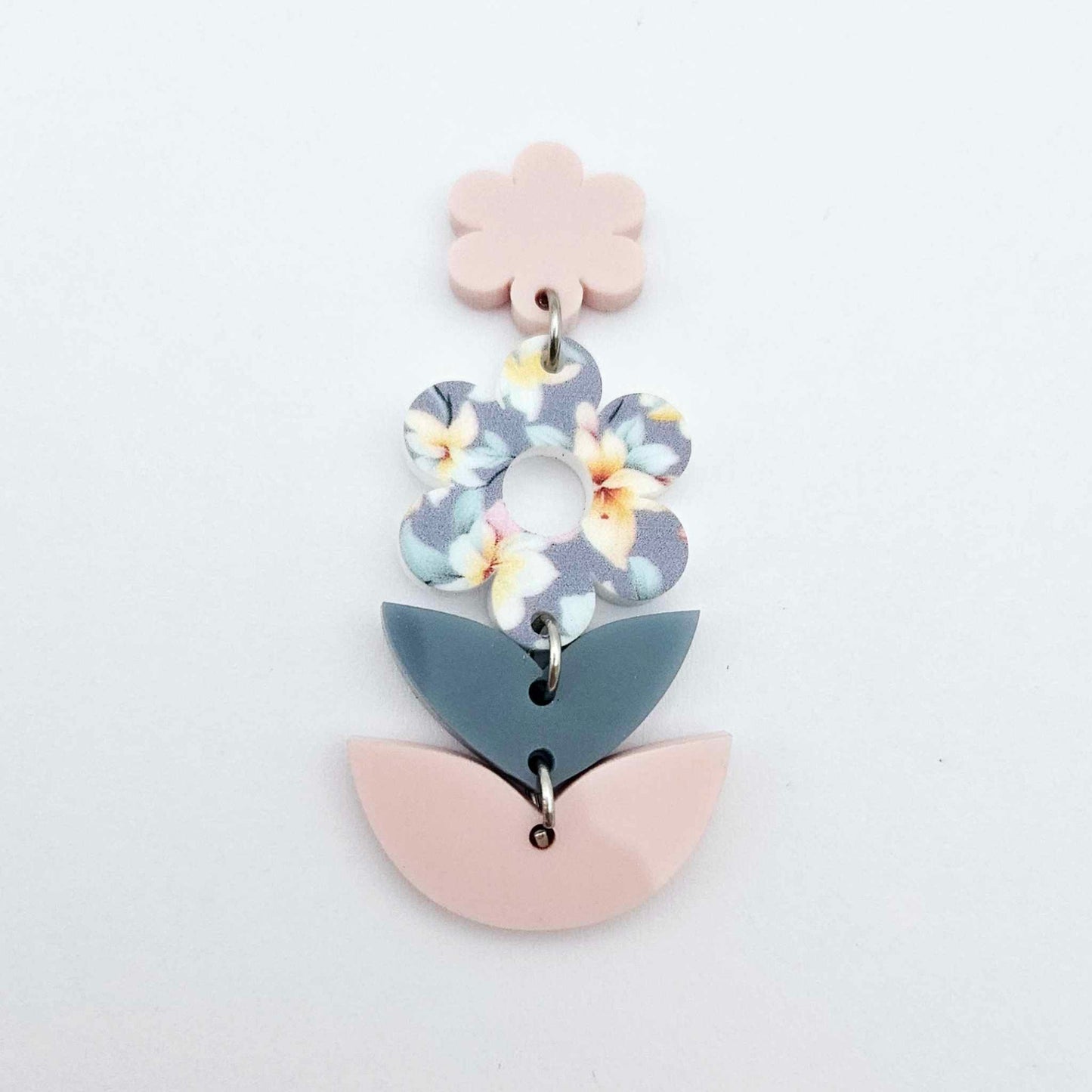 Assembled three-piece acrylic floral dangle hanging from a 14mm strawberry milkshake flower topper, Hawaii Dream UV printed flower with layered leaf pieces