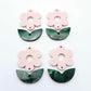 Two-piece Strawberry Milkshake pink flower and green mineral acrylic leafy dangle blanks shown unassembled and laying flat to display the full 31mm floral design