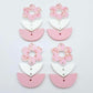 Three-piece acrylic flower dangle blanks shown unassembled laying flat, featuring Cherry Blosoom UV printed flower, white leafy middle and pastel pink leafy bottom