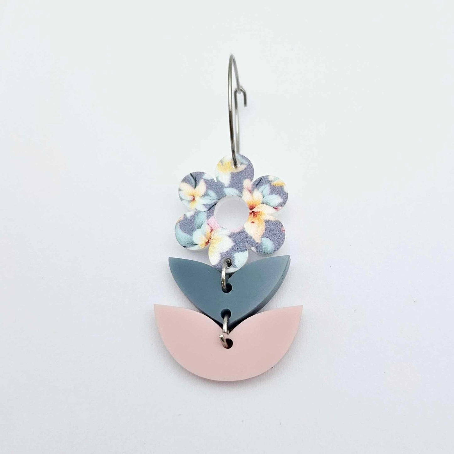 Assembled three-piece acrylic flower dangle hanging from a 20mm hoop, UV printed Hawaii Dream flower with bluestone and strawberry milkshake leaf layers