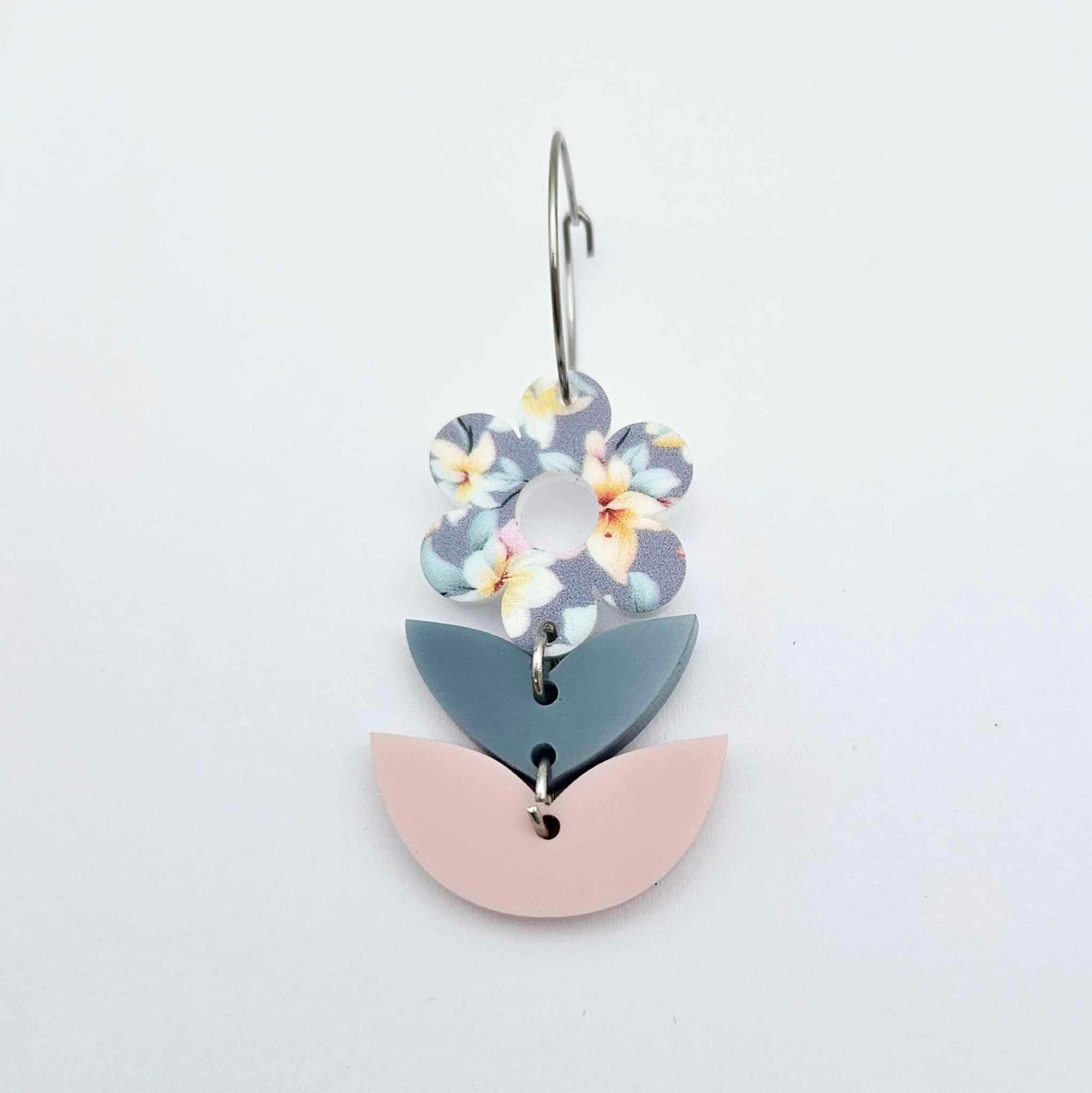 Assembled three-piece acrylic flower dangle hanging from a 20mm hoop, UV printed Hawaii Dream flower with bluestone and strawberry milkshake leaf layers