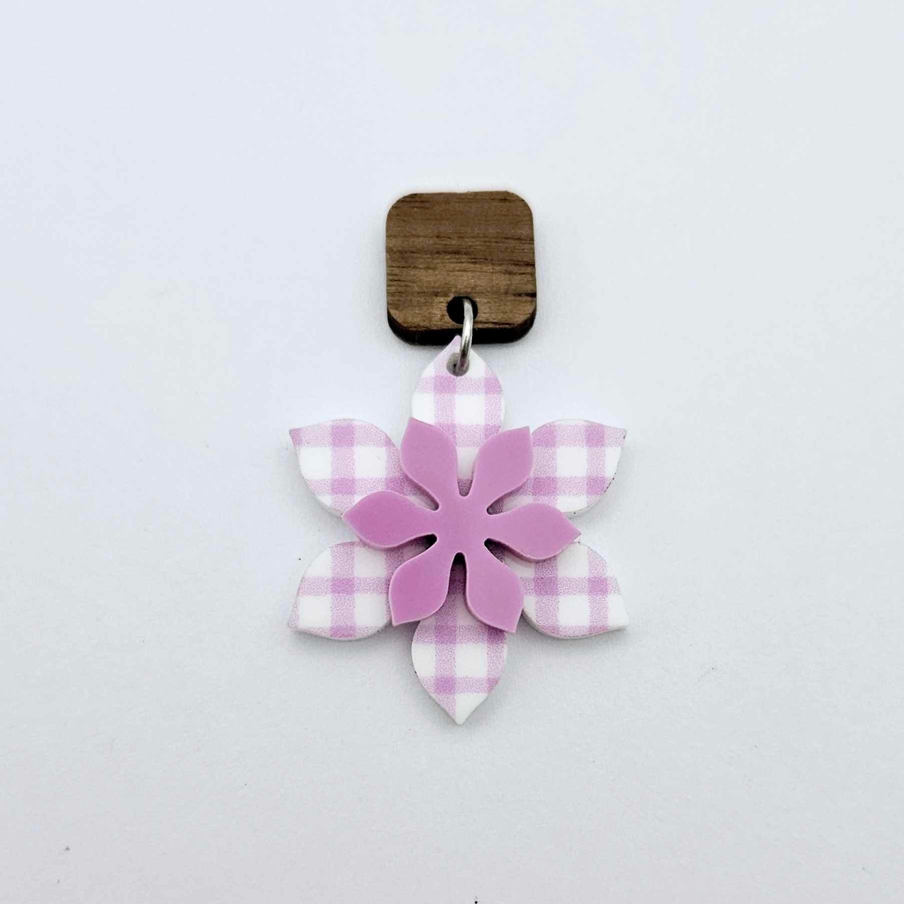 Layered purple gingham UV print and sour grape acrylic flower dangle assembled and hanging from a 12mm walnut wood topper, 3D two tone floral design