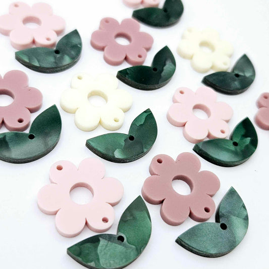 Two-piece flower and green mineral acrylic leafy dangle blanks shown unassembled and laying flat to display the full 31mm floral design
