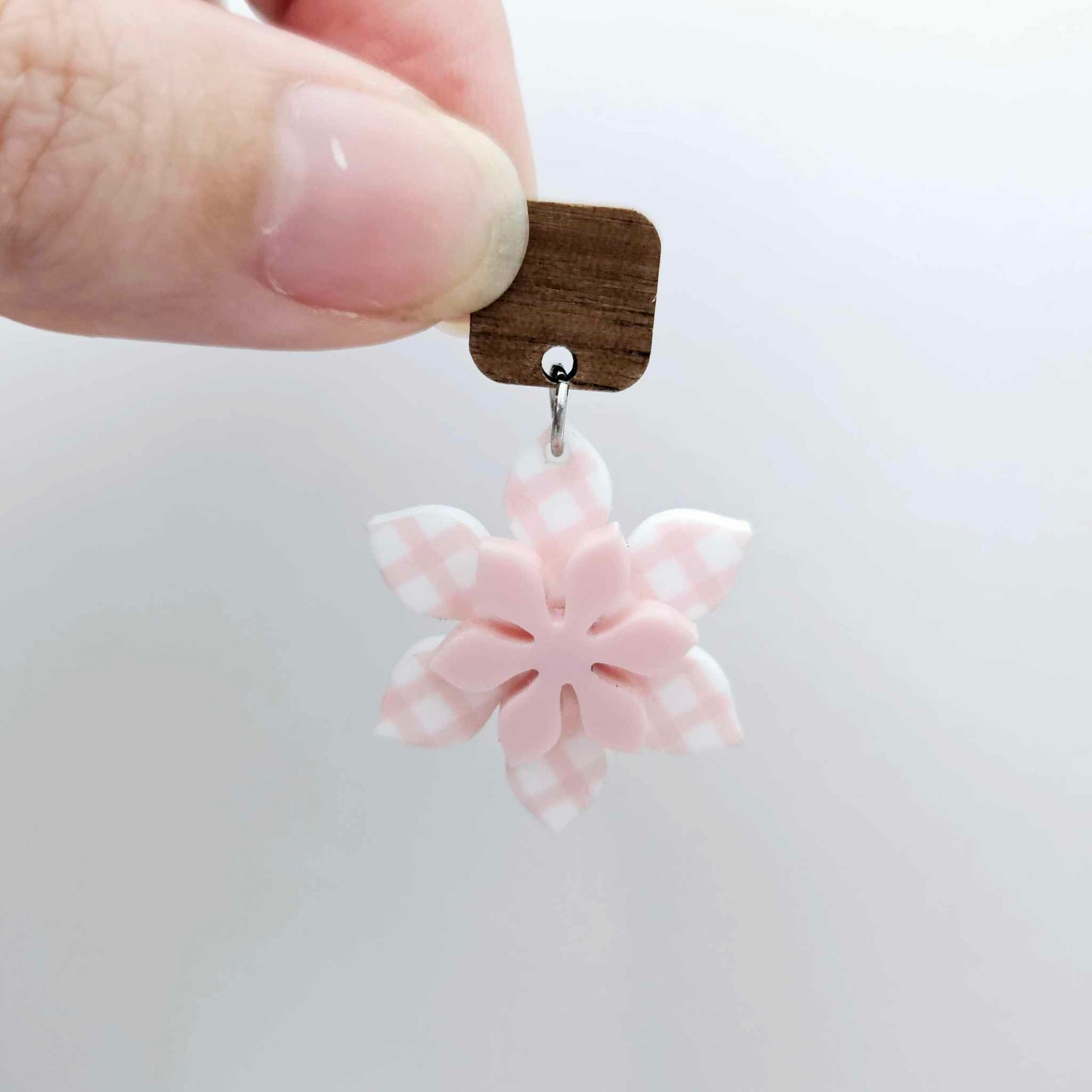 Layered pink gingham UV print and strawberry milkshake pink acrylic flower dangle assembled and hanging from a 12mm walnut wood topper, 3D two tone floral design