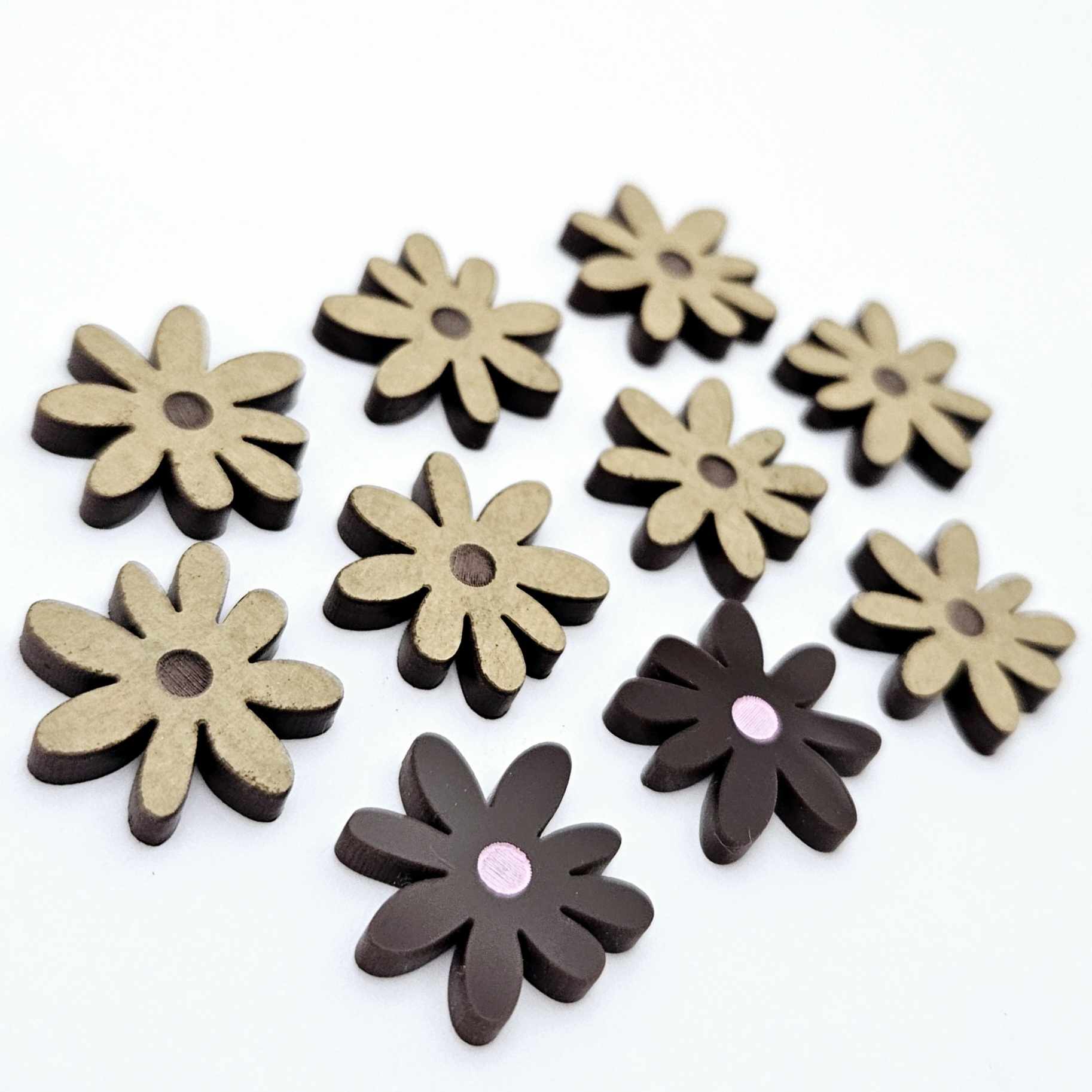17mm chocolate brown acrylic flower stud blanks with engraved centre detail, one pair paint filled light pink and peeled, with additional pieces shown with protective film on
