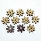 17mm chocolate brown acrylic flower stud blanks with engraved centre detail, one pair paint filled light pink and peeled, with additional pieces shown with protective film on