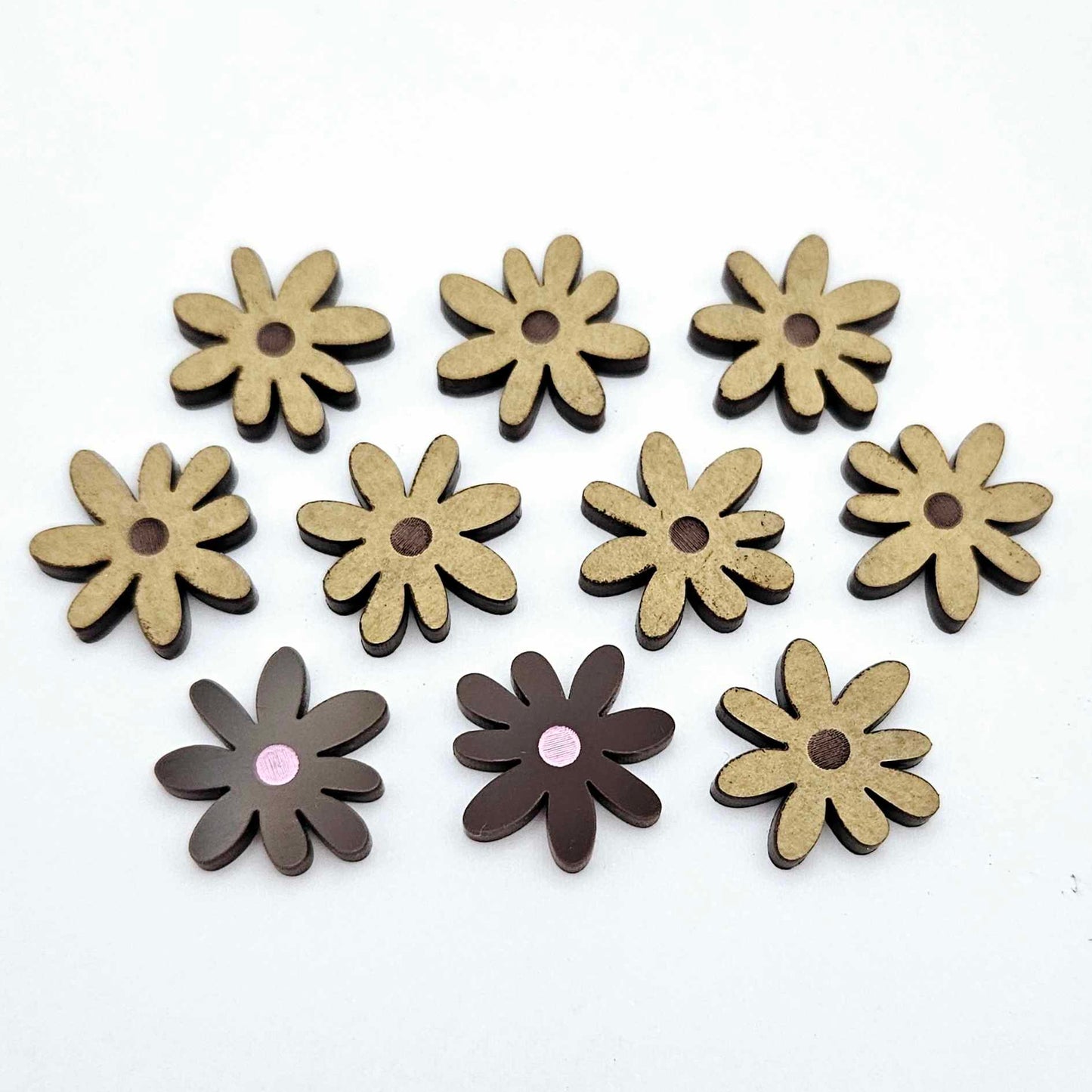 17mm chocolate brown acrylic flower stud blanks with engraved centre detail, one pair paint filled light pink and peeled, with additional pieces shown with protective film on