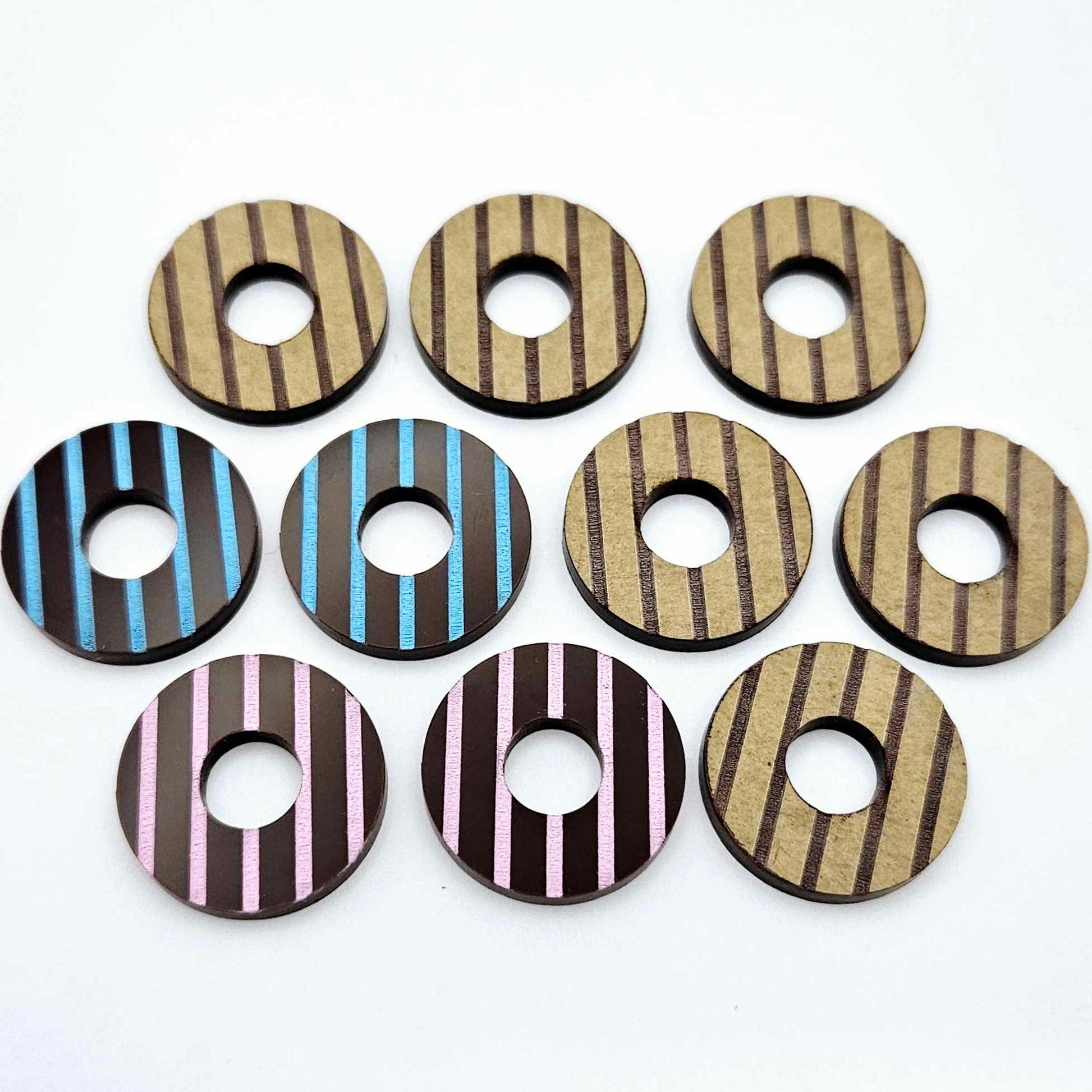 22mm chocolate brown acrylic striped hoop stud blanks with engraved stripes, one pair paint filled light pink and one light blue and peeled, with additional unpainted pieces shown with protective film on