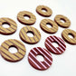 22mm Port wine (burgundy) acrylic striped hoop stud blanks with engraved stripes, one pair paint filled light pink and peeled, with additional unpainted pieces shown with protective film on