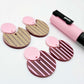 Nested circle dangle blanks showing one pair paint filled light pink and peeled, with another pair unpainted and with protective film on, pictured with a pink Posca paint pen