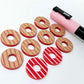 22mm red striped acrylic hoop stud blanks showing paint filled example and unpainted pieces with protective film, pictured with a light pink Posca paint pen