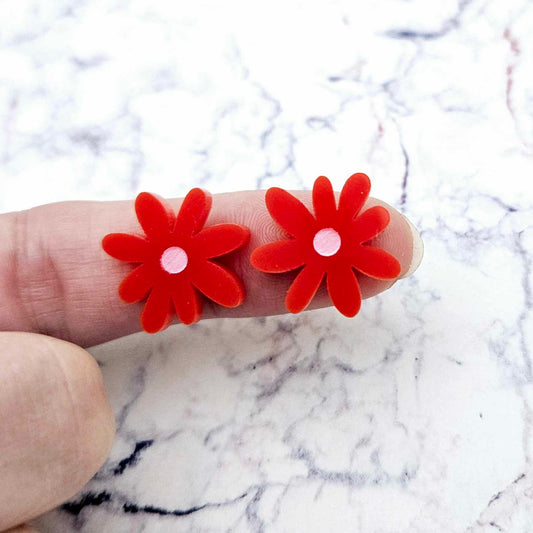 17mm red acrylic flower stud blanks with engraved centre detail, one pair paint filled light pink shown on finger for size reference
