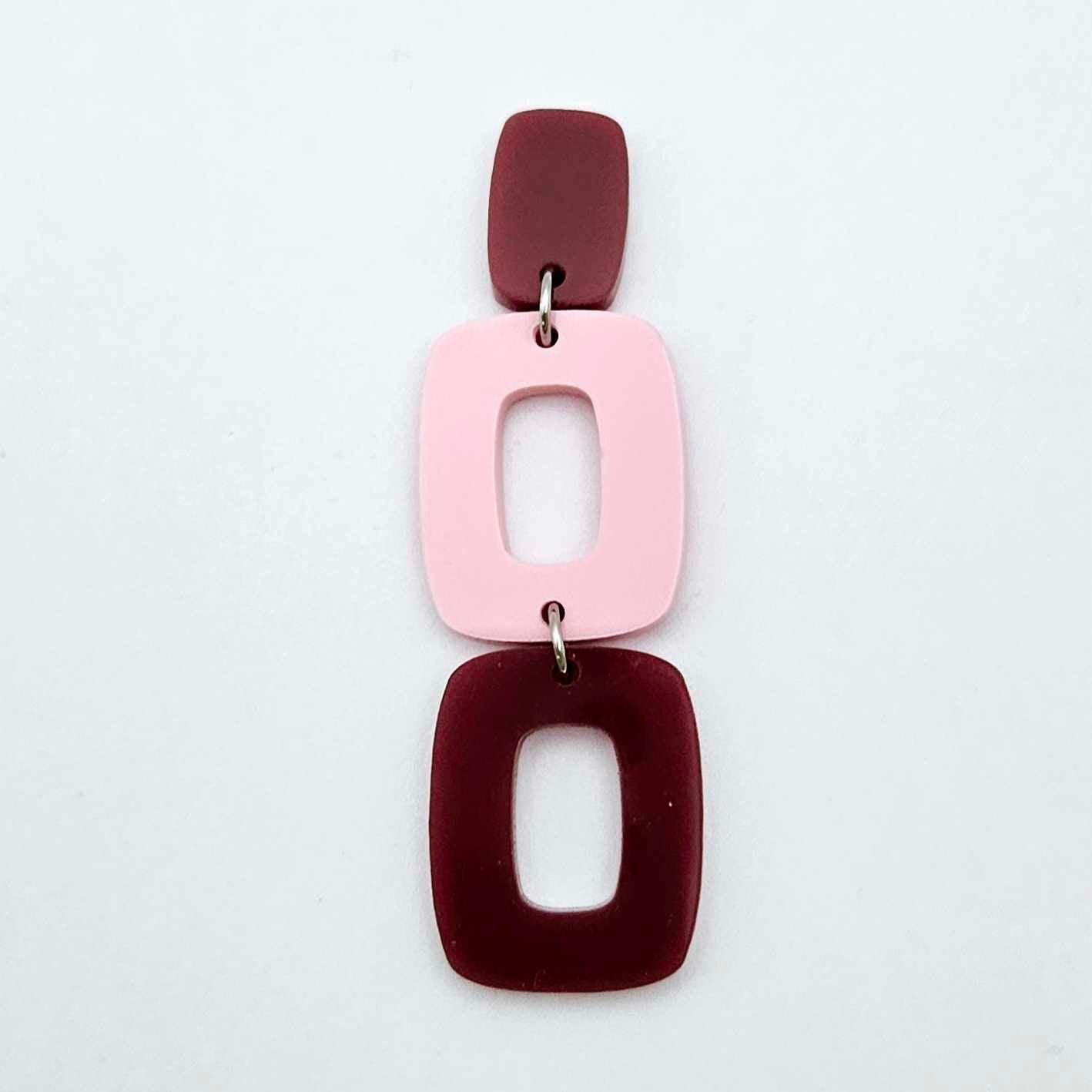 Assembled layered rectangle dangle earring in port wine and pastel pink acrylic, three-piece geometric statement design