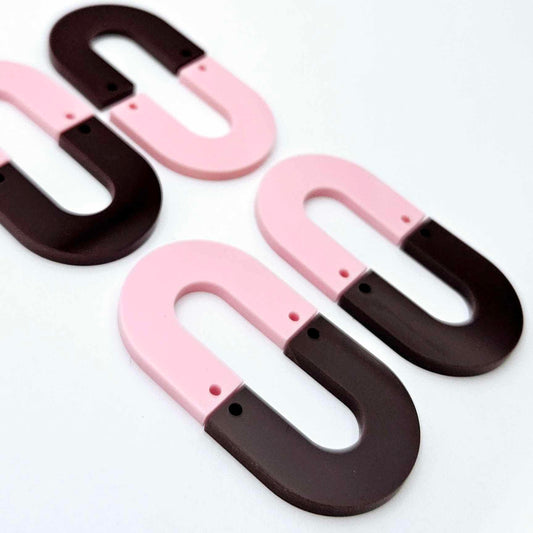 Layered U dangle blanks in pastel pink and chocolate brown acrylic, two pairs shown unassembled laying flat with matching U-shaped pieces