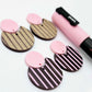 Nested circle dangle blanks showing one piece paint filled light pink and peeled, with another pair unpainted and with protective film on, pictured with a pink Posca paint pen