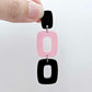 Assembled layered rectangle dangle earring in chocolate brown and pastel pink acrylic, three-piece geometric statement design