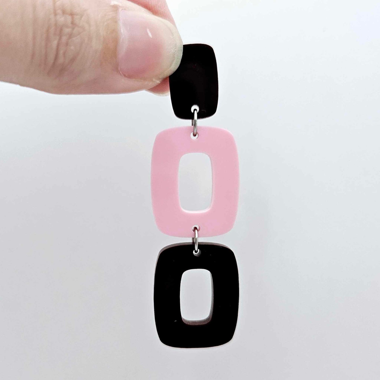 Assembled layered rectangle dangle earring in chocolate brown and pastel pink acrylic, three-piece geometric statement design