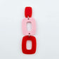 Assembled layered rectangle dangle earring in red and pastel pink acrylic, three-piece geometric statement design