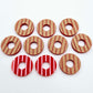 22mm red acrylic striped hoop stud blanks with engraved stripes, one pair paint filled light pink and peeled, with additional unpainted pieces shown with protective film on