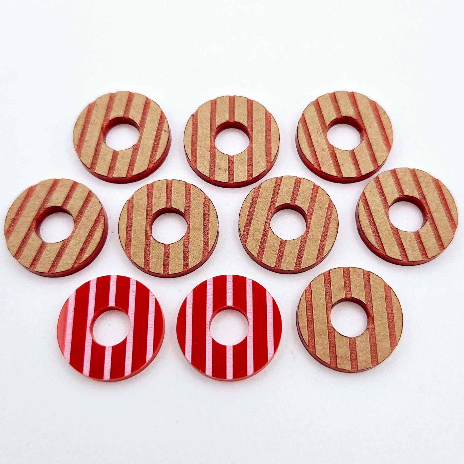 22mm red acrylic striped hoop stud blanks with engraved stripes, one pair paint filled light pink and peeled, with additional unpainted pieces shown with protective film on
