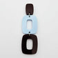 Assembled layered rectangle dangle earring in chocolate brown and pastel blue acrylic, three-piece geometric statement design