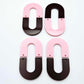 Layered U dangle blanks in pastel pink and chocolate brown acrylic, two pairs shown unassembled laying flat with matching U-shaped pieces