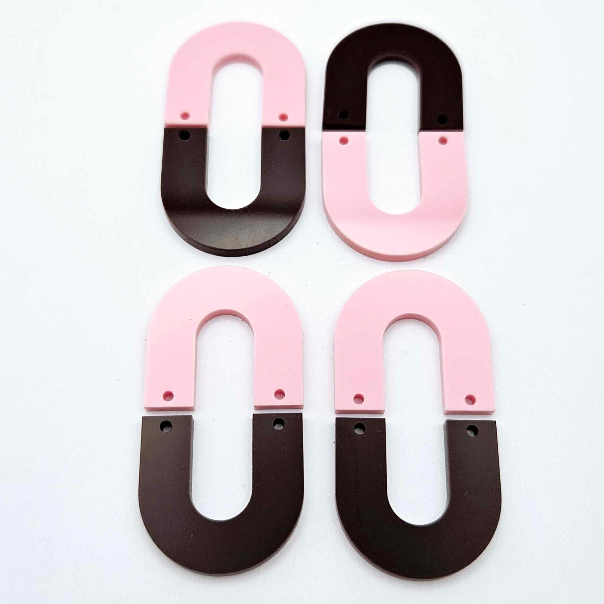 Layered U dangle blanks in pastel pink and chocolate brown acrylic, two pairs shown unassembled laying flat with matching U-shaped pieces