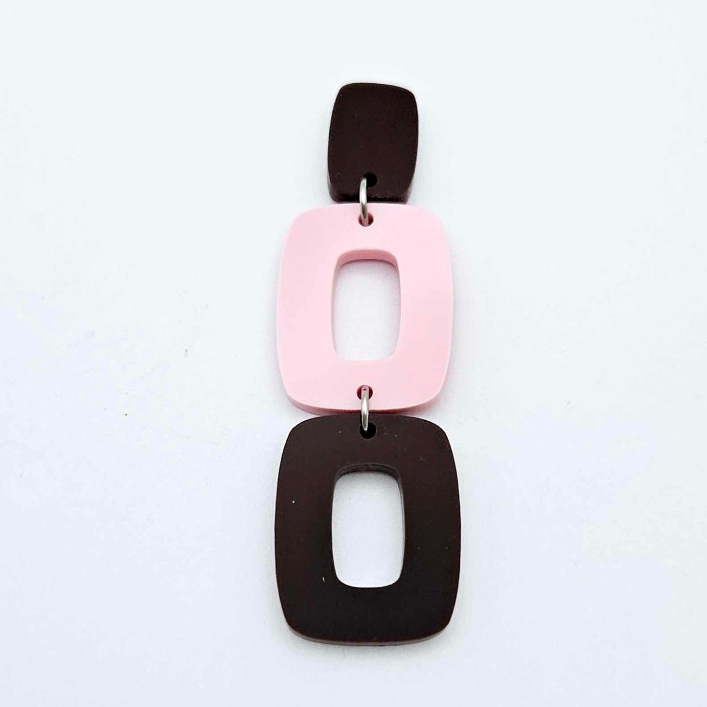 Assembled layered rectangle dangle earring in chocolate brown and pastel pink acrylic, three-piece geometric statement design