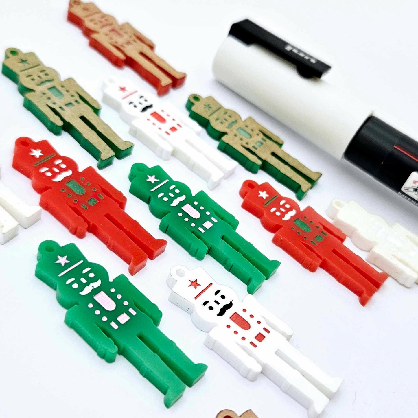 40mm nutcracker Christmas dangle blanks with engraved paint-fill details shown in green, red and white acrylic