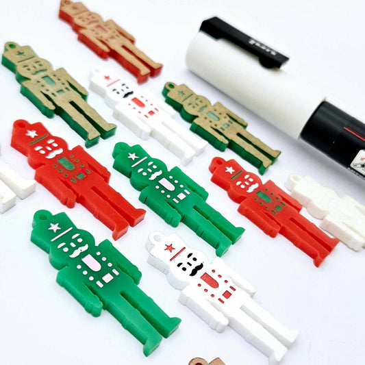 40mm nutcracker Christmas dangle blanks with engraved paint-fill details shown in green, red and white acrylic