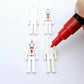 40mm nutcracker Christmas dangle blanks with engraved paint-fill details shown in  white acrylic with red posca paint pens