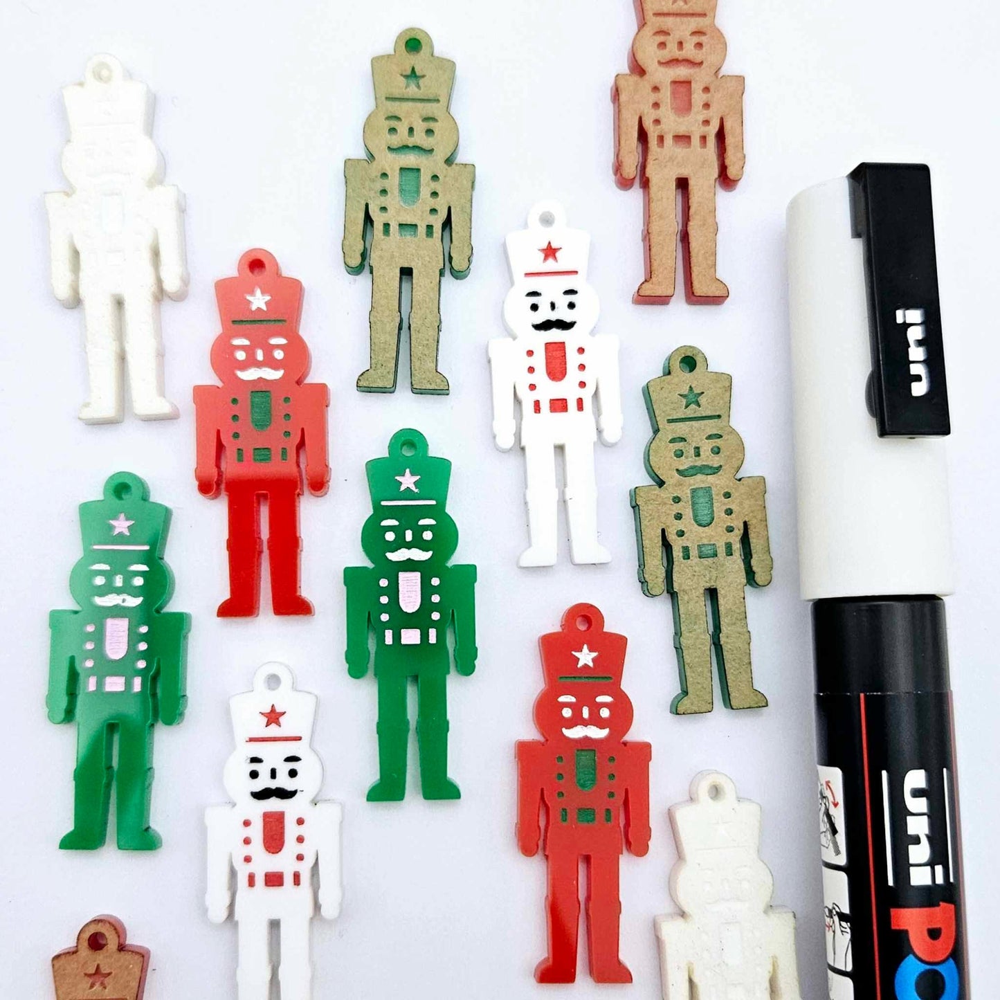 40mm nutcracker Christmas dangle blanks with engraved paint-fill details shown in green, red and white acrylic