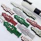40mm nutcracker Christmas dangle blanks with engraved paint-fill details shown in green, red and silver glitter acrylic