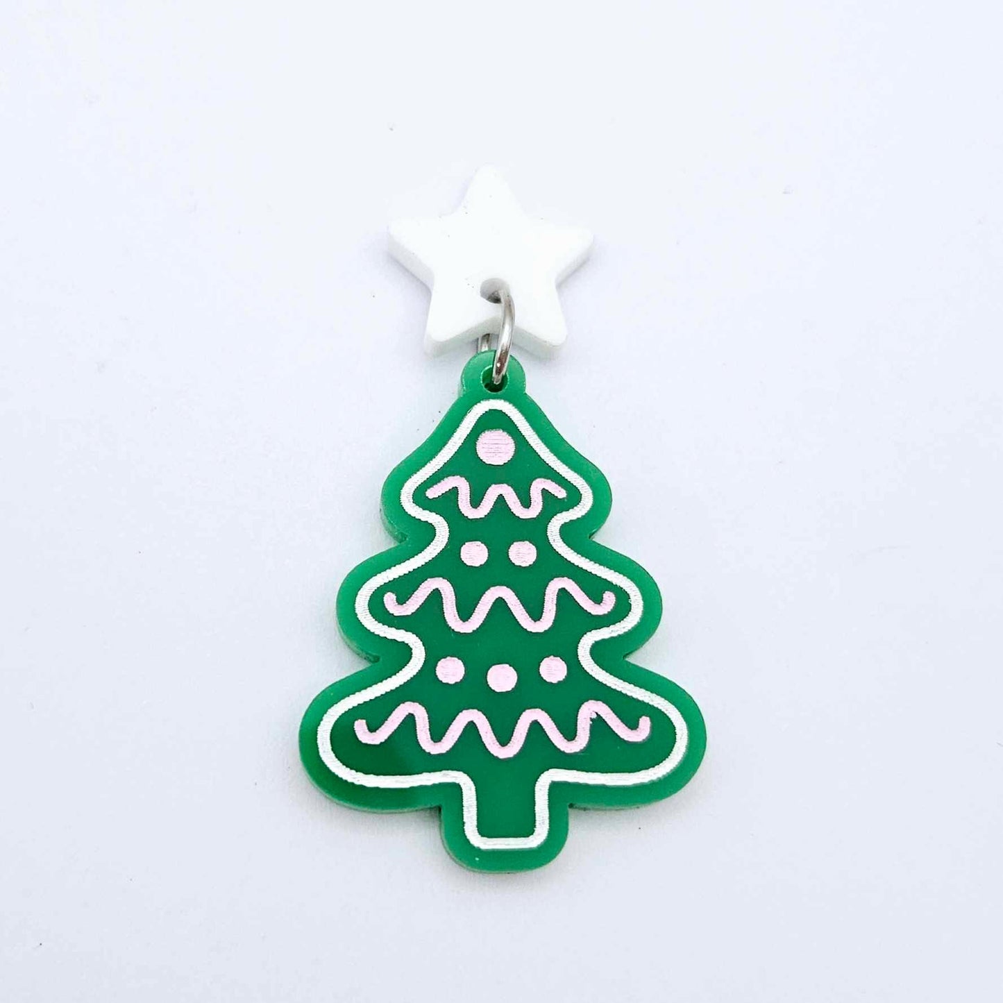 One solid green cookie Christmas tree dangle with engraved icing details paint filled in light pink and white, assembled with a 16mm white star topper